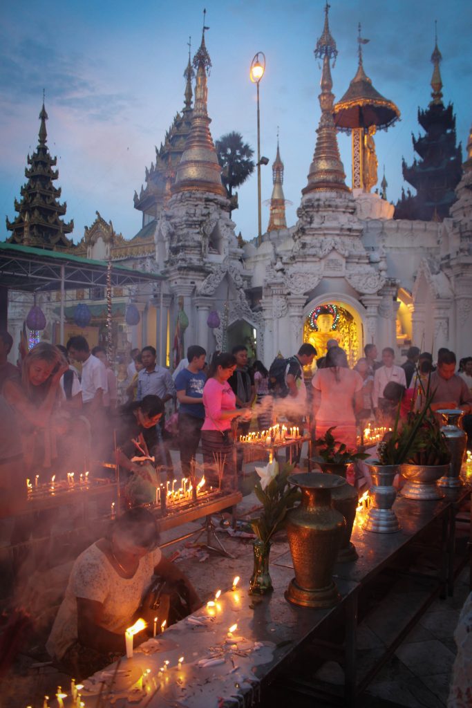 Colourful lanterns and flower decorations inside Shwedagon Pagoda. (Photo: Libby Hogan / DVB)